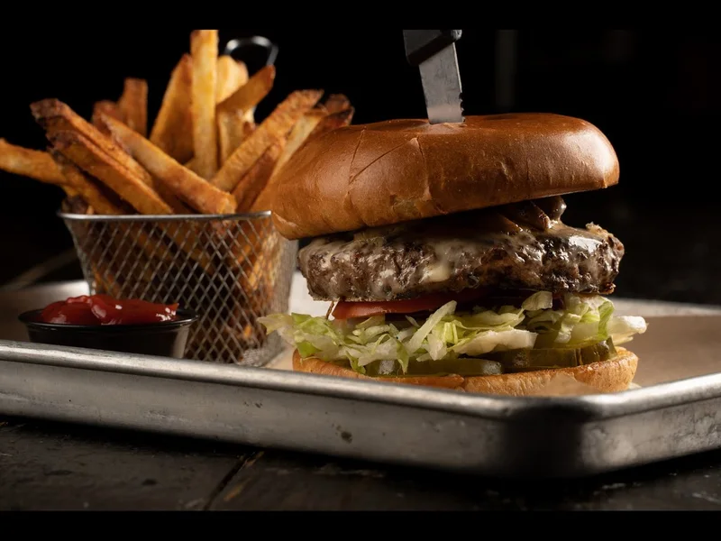 Mushroom Swiss burger, melted swiss over the patty with mushrooms under the bun
