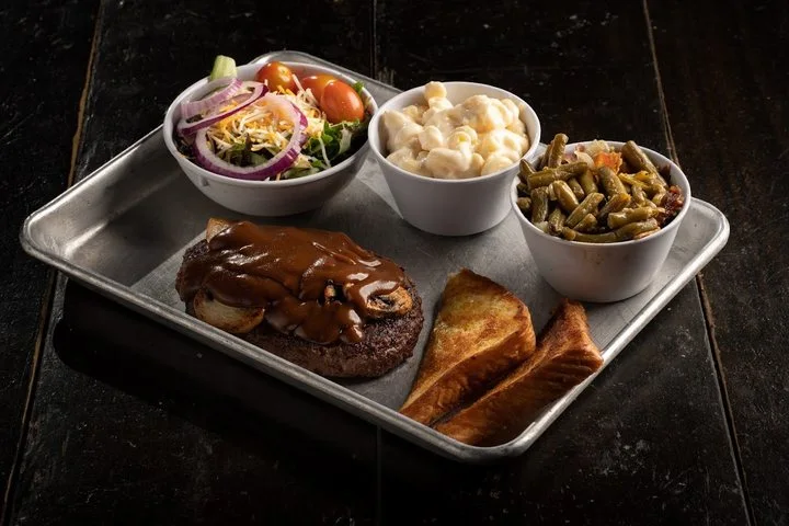 Hamburger steak smothered in brown gravy